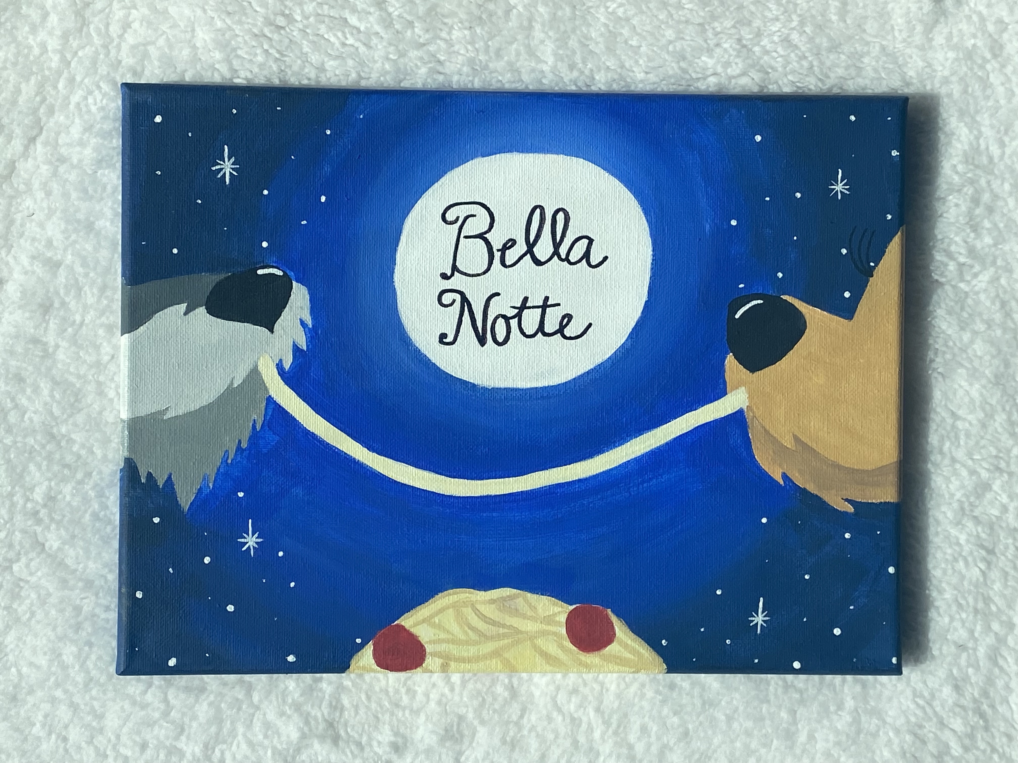 Lady and the Tramp enjoy spaghetti in front of a starry night sky.