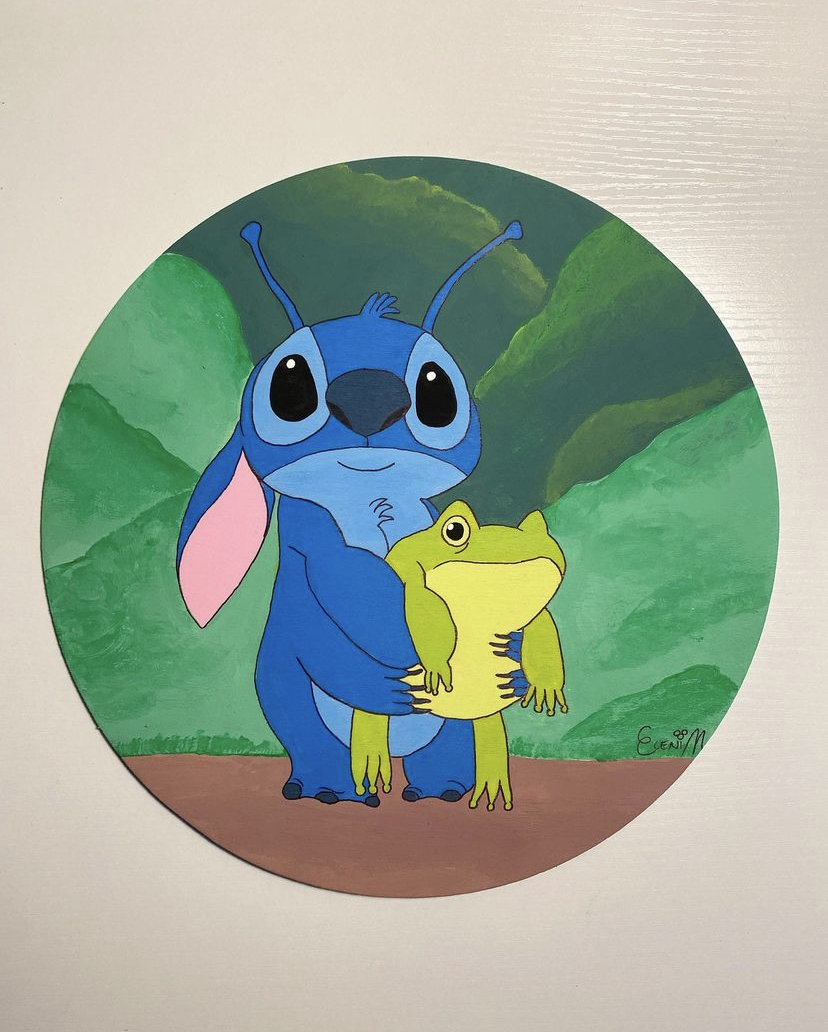 A handpainted door showcasing a collage of Disney characters throughout the years.