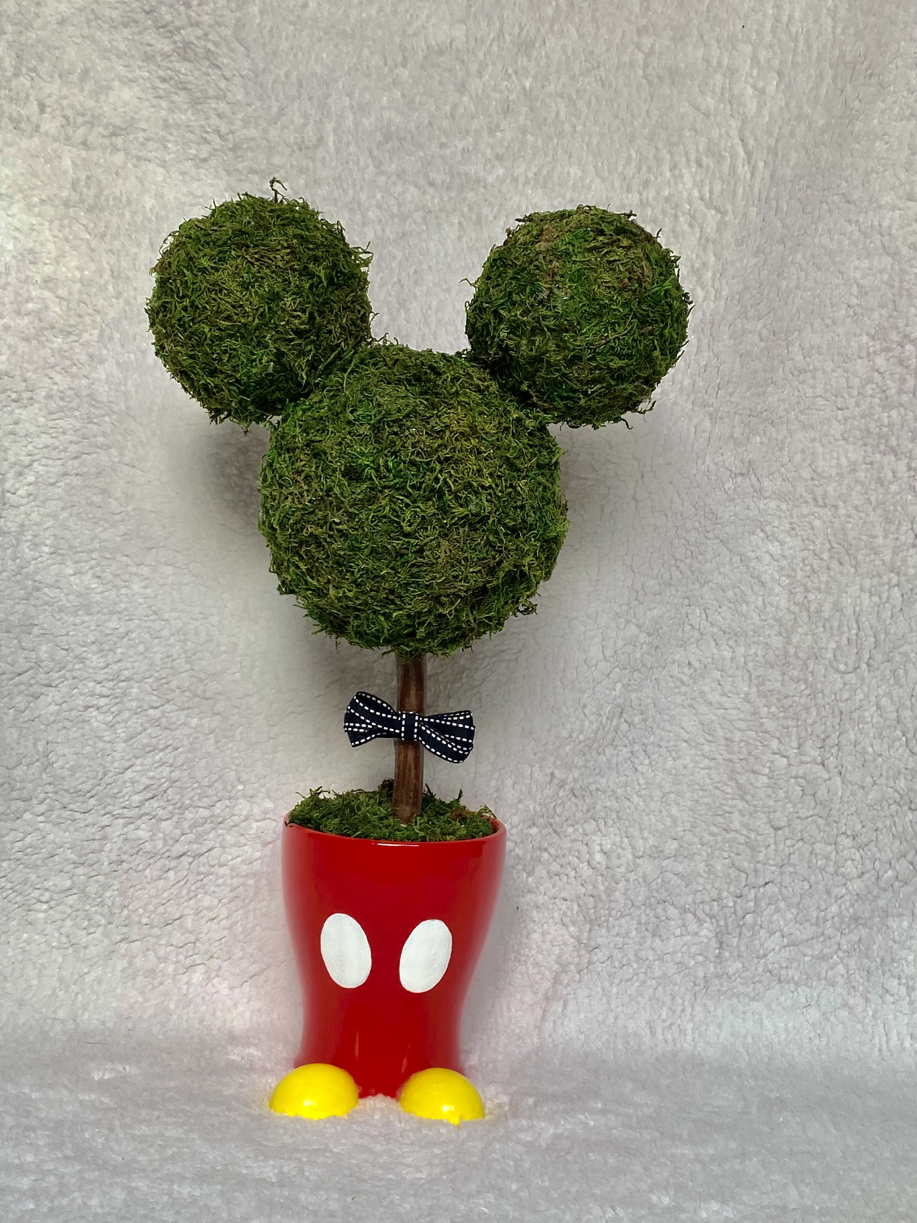 With a little red pot, two white buttons, and a three green spheres, I was able to bring Mickey Mouse to life in topiary form.